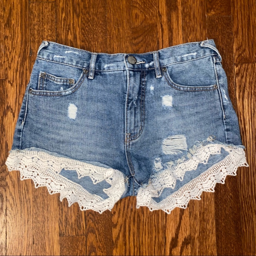 Free People denim shorts with lace at the bottom